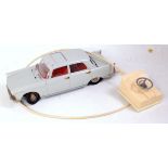 A Joustra of France tinplate and battery operated model of a Peugeot 404,