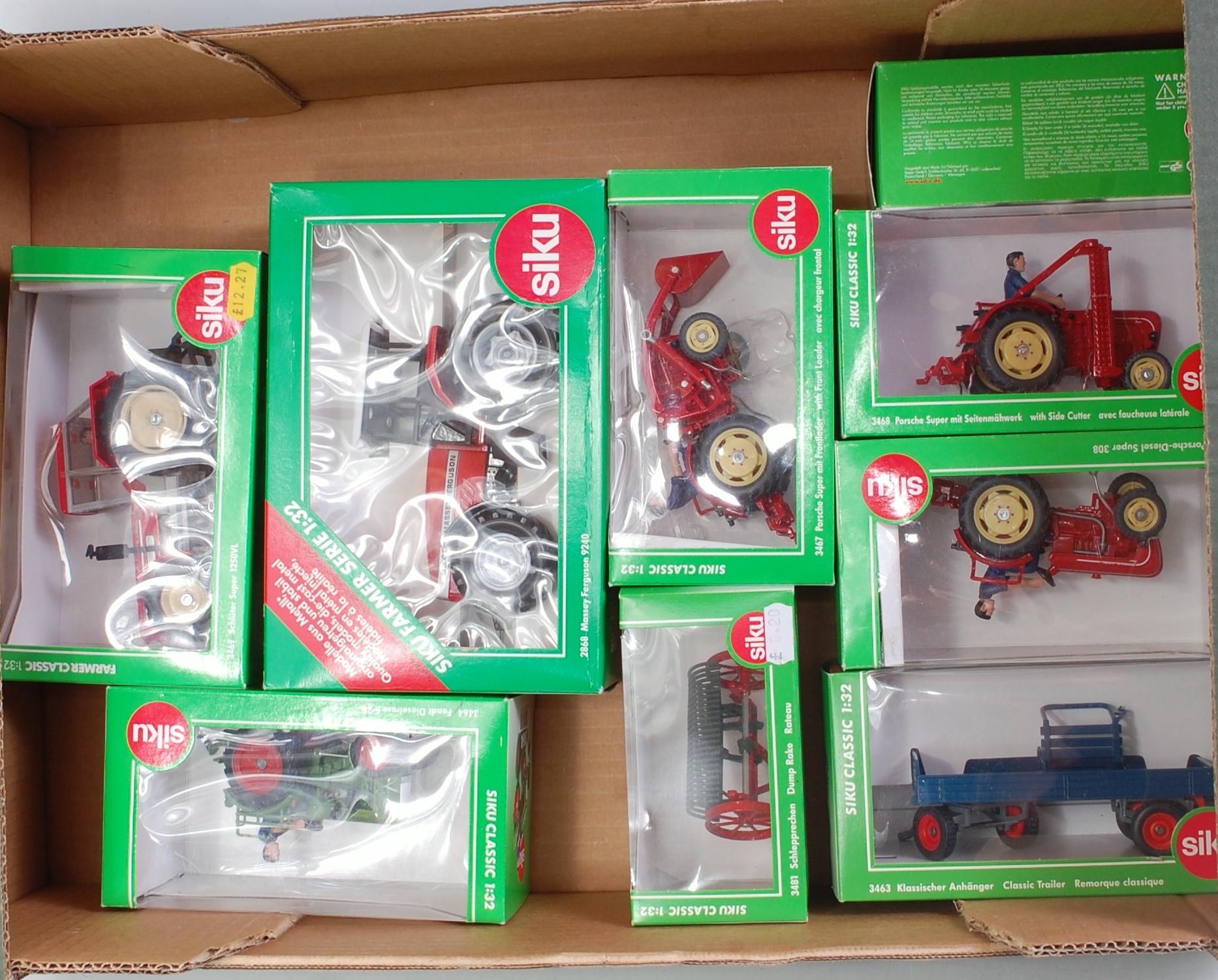 Nine various boxed Siku 1/32 scale farming diecast and implements,