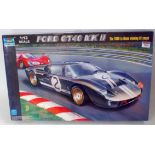 A Trumpeter 1/12 scale plastic kit for a Ford GT MkII 1966 Le Mans winner car, appears as issued,