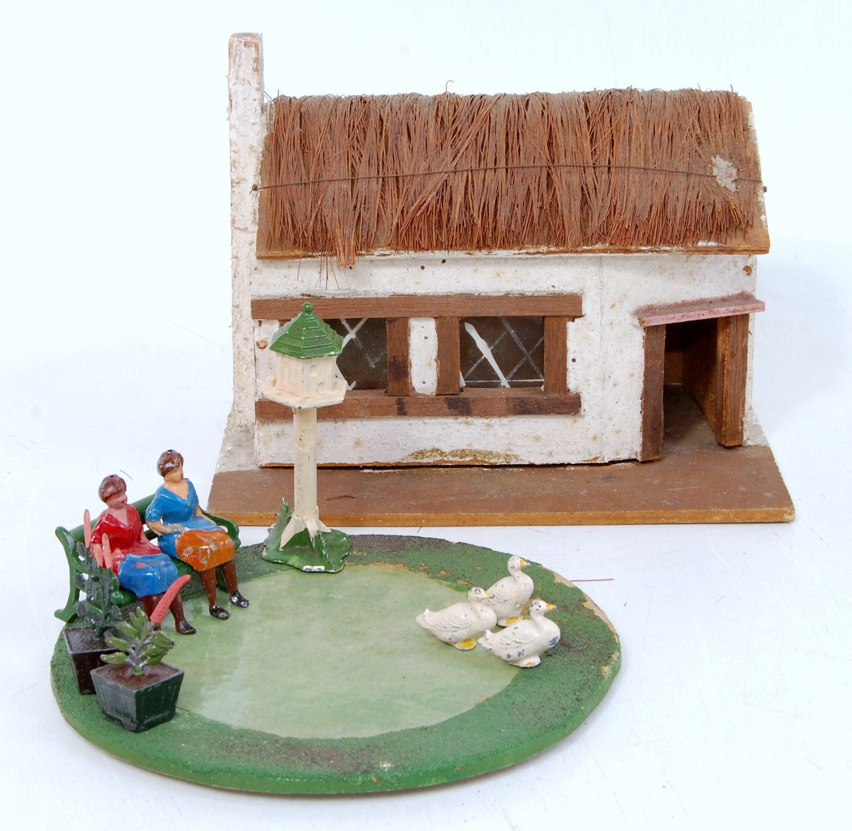 A mixed lot of farm related and civilian wooden and hollow cast figures and accessories to include