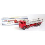 A Dinky Toys 905 Foden Flat truck with chains comprising red cab and chassis with grey back and red