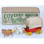 A Modern Product hollowcast model of a covered wagon, with driver, hood, and four horses,