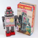 SH Toys of Japan, tinplate and clockwork operated Gear Robot, grey/silver body with red feet,