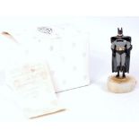 A Warner Bros Production white metal and faux onyx limited edition figurine of Batman numbered
