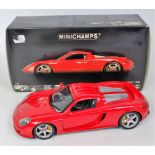 Minichamps 1/18th scale model of a Porsche Carrera GT, finished in red,