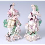 A pair of 18th century Derby Shepherd and Shepherdess figures,