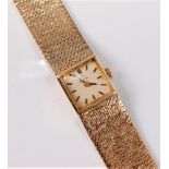 A lady's 9ct Omega wristwatch, the square dial, 14mm wide, with baton numerals,