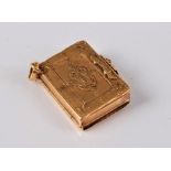 A miniature book memorial locket, the engraved case with clasp,