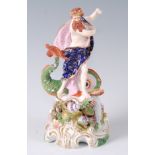 A Derby porcelain figure of Neptune, standing upon a base encrusted with shells, coral and seaweed,