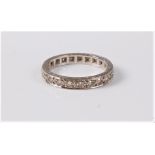 An 18ct full hoop diamond eternity ring, the single cut diamonds, total estimated weight approx. 0.