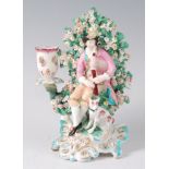 A Derby porcelain bocage candle-holder figure group,