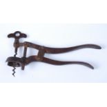 A rare English Hampton lever corkscrew, with a bronze patina single lever with captive corkscrew,