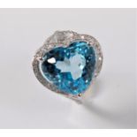A topaz and diamond ring, the horizontally set heart shaped topaz in a three claw mount,
