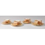 A Royal Worcester blush ware set of four porcelain trio's, comprising tea cup, saucer and plate,