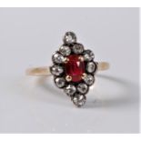 A synthetic ruby and diamond ring, the oval ruby, approx. 6.2 x 4.