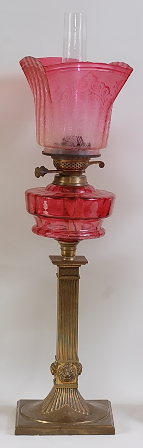 A late Victorian brass pedestal oil lamp,