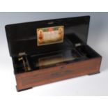 A circa 1900 Swiss rosewood cased music box, the 11" cylinder playing ten airs,