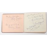 An autograph album containing approx 100 film and stage star signatures, to include Julie Andrews,