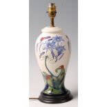 A modern Moorcroft pottery table lamp in the Ladybird pattern, of baluster form,