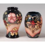 A small modern Moorcroft pottery vase in the Oberon pattern, of baluster form,