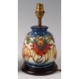 A modern Moorcroft pottery lamp in the Anna Lily pattern, of mallet form,