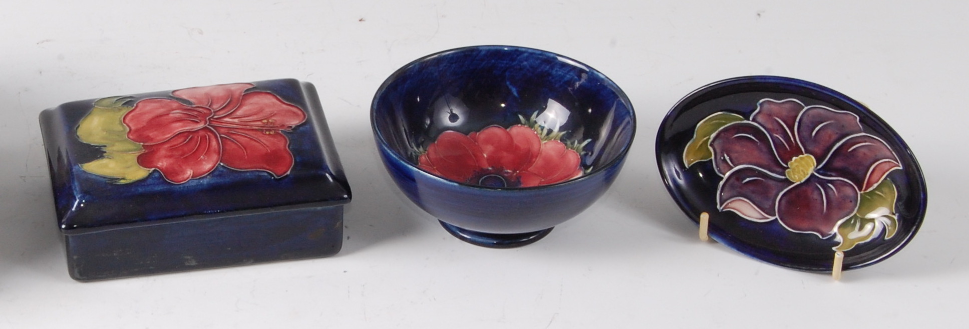An early 20th century Moorcroft pottery soap dish and cover in the Clematis pattern,