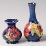 An early 20th century Moorcroft pottery bottle vase in the Hibiscus pattern,