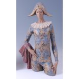 A large Lladro pottery figure of a Harlequin, underglaze painted and high-fired,