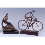 A contemporary bronze model of a cyclist, of stylised and elongated form, golden brown patina,