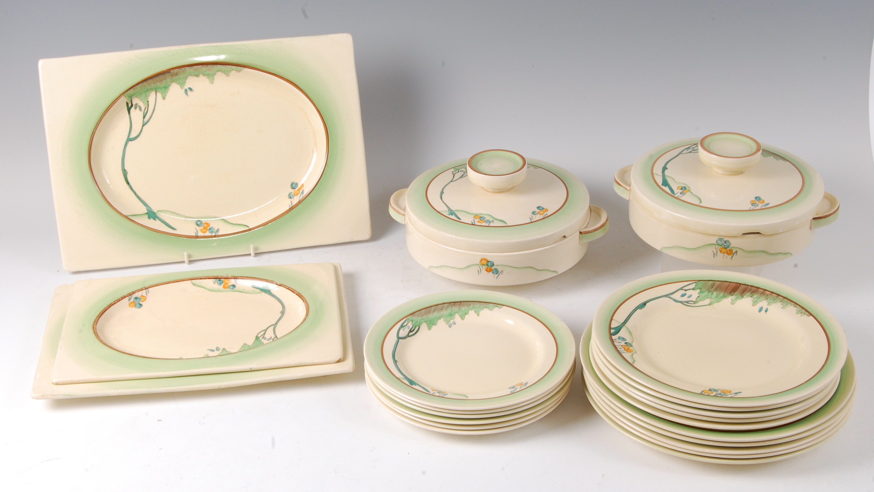 A collection of 1930s Clarice Cliff Taormina tableware,