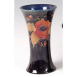 An early 20th century Moorcroft Pomegrante pattern pottery vase, of waisted form,