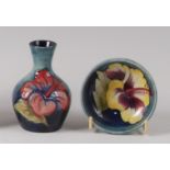An early 20th century Moorcroft pottery shouldered squat vase in the Hibiscus pattern,