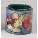An early 20th century Moorcroft pottery dressing table tidy in the Anemone pattern,