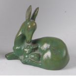 Georges Laurent - An Art Deco green patinated bronze figure of a deer with fawn, in recumbent pose,