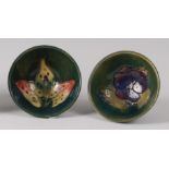 An early 20th century Moorcroft pottery miniature footed circular finger bowl in the Arun Lily