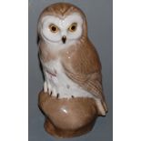 A Proletary Russian porcelain model of an owl having green rosebud mark verso,