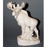 A large Lomonosov white glazed figure of a moose in standing pose, printed mark verso, made in USSR,