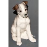 A Konakova Russian porcelain model of a dog in seated pose, modelled on Laika,