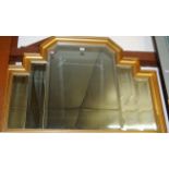 A modern gilt framed and bevelled wall mirror,