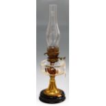 An early 20th century brass pedestal oil lamp,