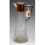 An the manner of Christopher Dresser, a cut glass and silver plated claret jug,