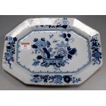 An 18th century English Delft platter of octagonal form typically decorated with basket of flowers