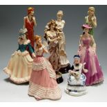 A collection of eight various English and continental figurines to include Royal Doulton classique