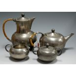 An early 20th century continental pewter four piece tea and coffee service of squat circular form