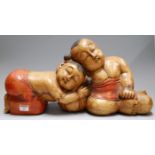 A large modern carved softwood figure group of two children, h.