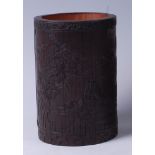 A Chinese well-carved bamboo brush pot, the obverse carved with pagoda and river landscape scene,