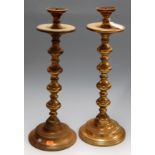 A pair of large turned brass table candlesticks, h.