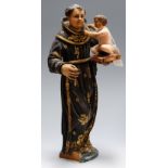 An early 20th century carved pine and polychrome painted religious figure,