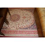 A contemporary Keshan cream ground rug,