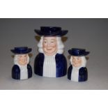 A novelty money-box in the form of a Quaker, and matching cruets (3)